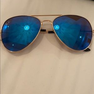 Ray bans with blue lenses and gold trim